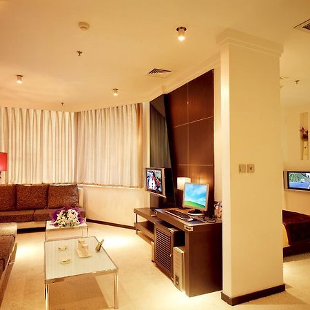 Dalian San Jiang Business Hotel Habitación foto